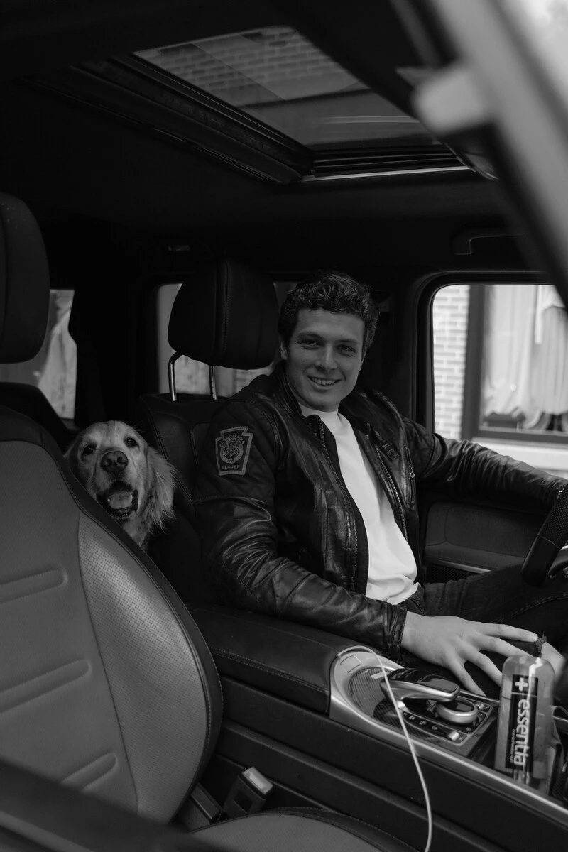 Ricardo Garcia with his dog in the car.